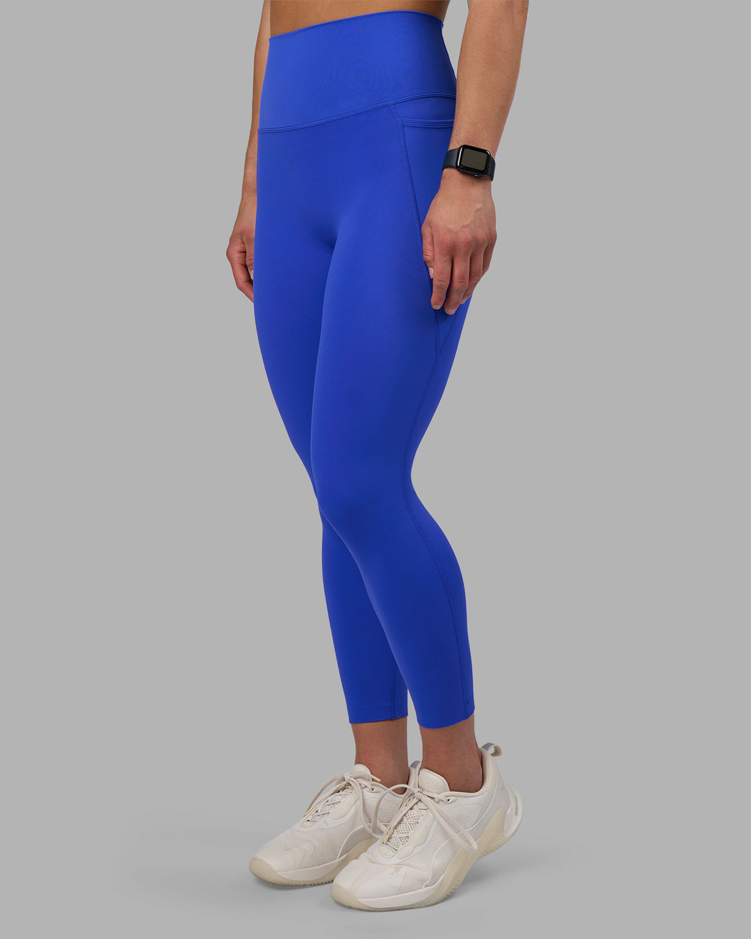 Woman wearing Elixir Ultra High-Rise 7/8 Legging Pockets - Power Cobalt | Model:Keisha | Size:S - view 1