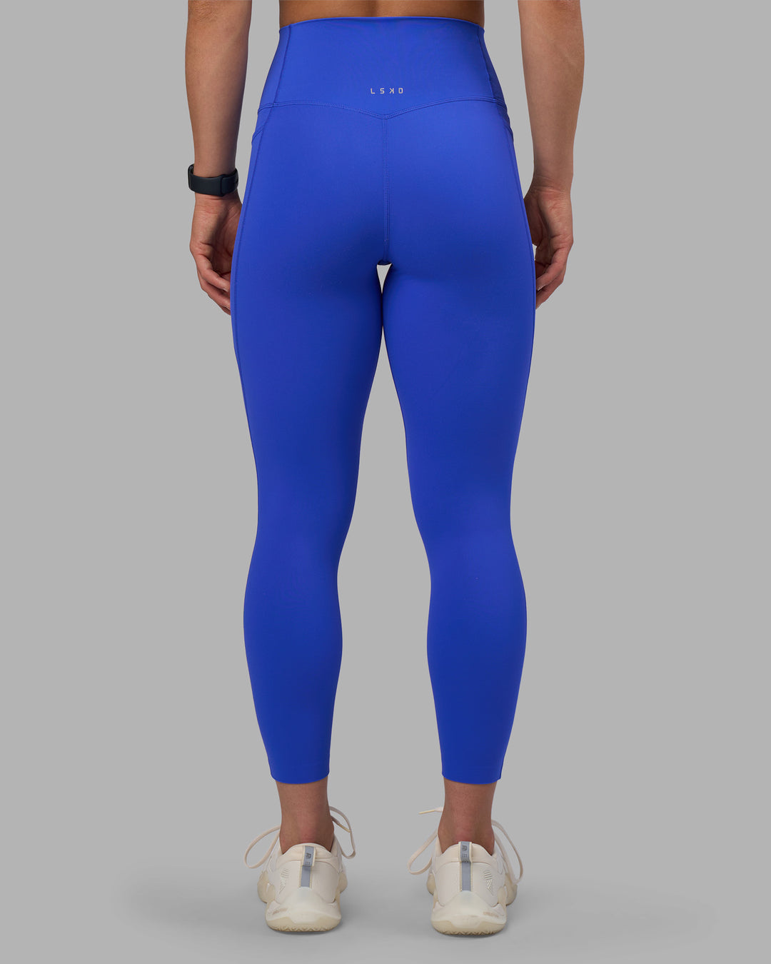 Woman wearing Elixir Ultra High-Rise 7/8 Legging Pockets - Power Cobalt | Model:Keisha | Size:S - view 4