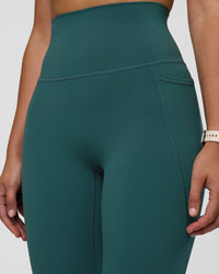 Woman wearing Elixir Ultra High-Rise 7/8 Legging Pockets - Transformative Teal | Model:Myrte | Size:S | Thumbnail Index: 2