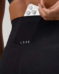 Woman wearing Elixir Ultra High-Rise Full Length Legging - Black | Model:Amity | Size:S | Thumbnail Index: 2