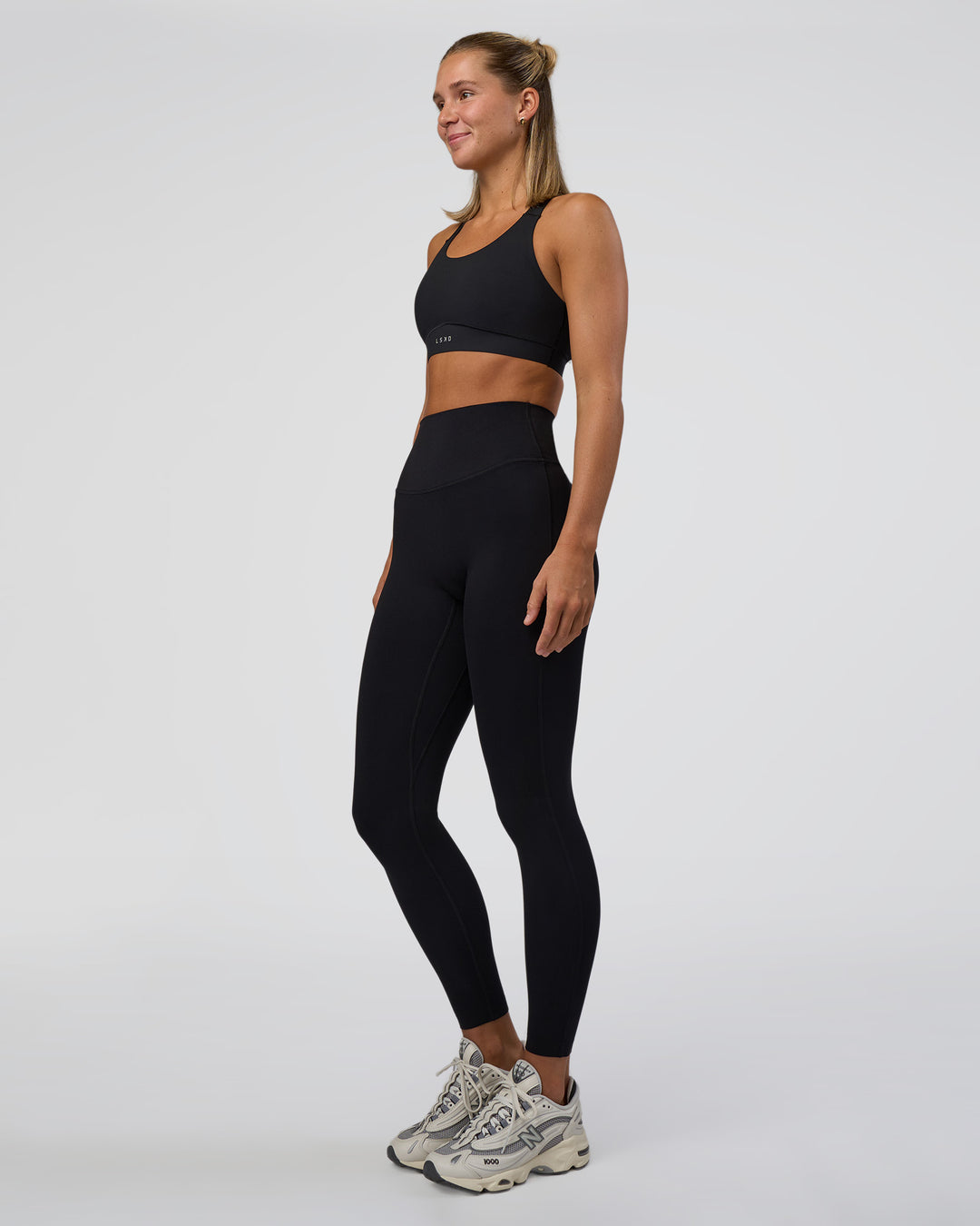 Woman wearing Elixir Ultra High-Rise Full Length Legging - Black | Model:Amity | Size:S - view 5