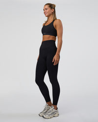 Woman wearing Elixir Ultra High-Rise Full Length Legging - Black | Model:Amity | Size:S | Thumbnail Index: 4