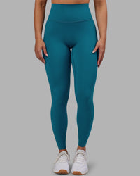 Woman wearing Elixir Ultra High-Rise Full Length Legging - Blue Coral | Model:Ayla | Size:S | Thumbnail Index: 0