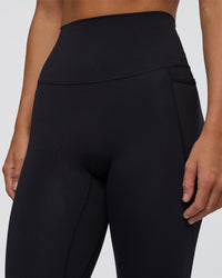 Woman wearing Elixir Ultra High-Rise Full Length Legging Pockets - Black | Model:Amity | Size:S | Thumbnail Index: 5