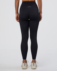 Woman wearing Elixir Ultra High-Rise Full Length Legging Pockets - Black | Model:Amity | Size:S | Thumbnail Index: 3
