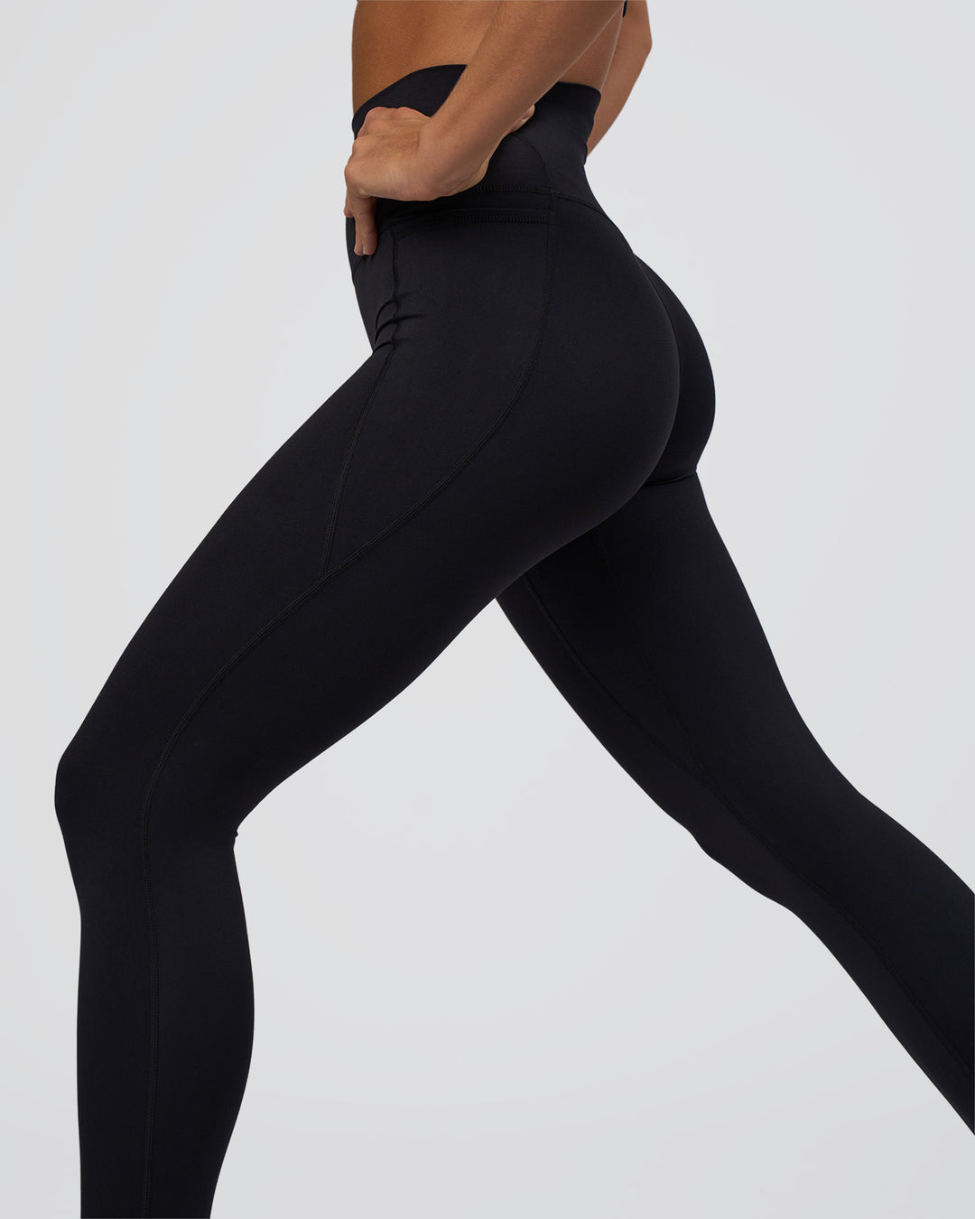Woman wearing Elixir Ultra High-Rise Full Length Legging Pockets - Black | Model:Amity | Size:S - view 2