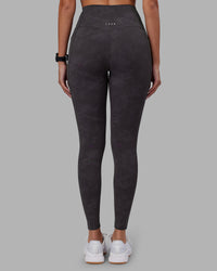 Woman wearing Elixir Ultra High-Rise Full Length Legging Pockets - Dark Storm Wash | Model:Rhiley | Size:S | Thumbnail Index: 3
