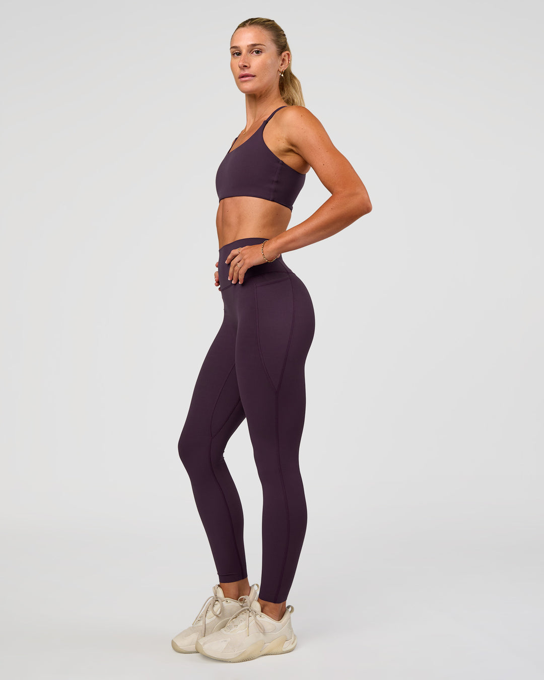 Woman wearing Elixir Ultra High-Rise Full Length Legging Pockets - Midnight Plum | Model:Emelia | Size:S - view 7
