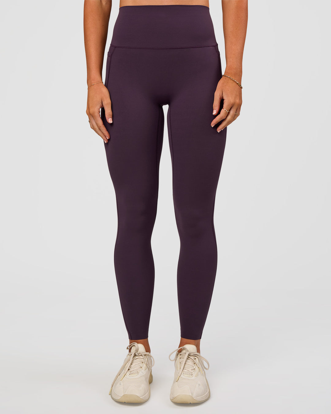 Woman wearing Elixir Ultra High-Rise Full Length Legging Pockets - Midnight Plum | Model:Emelia | Size:S - view 4