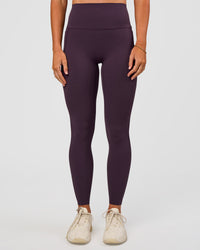 Woman wearing Elixir Ultra High-Rise Full Length Legging Pockets - Midnight Plum | Model:Emelia | Size:S | Thumbnail Index: 3