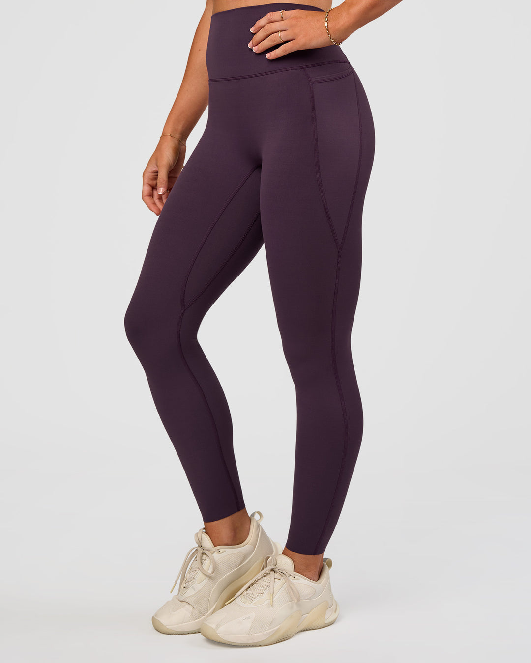 Woman wearing Elixir Ultra High-Rise Full Length Legging Pockets - Midnight Plum | Model:Emelia | Size:S - view 1