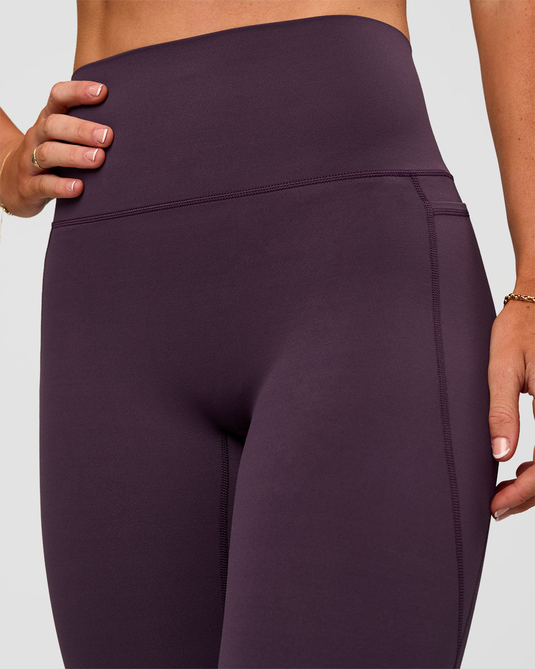 Woman wearing Elixir Ultra High-Rise Full Length Legging Pockets - Midnight Plum | Model:Emelia | Size:S - view 9