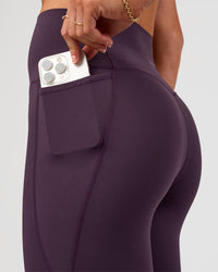 Woman wearing Elixir Ultra High-Rise Full Length Legging Pockets - Midnight Plum | Model:Emelia | Size:S | Thumbnail Index: 5