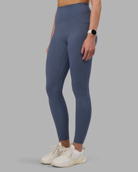 Woman wearing Elixir Ultra High-Rise Full Length Legging Pockets - Night Shadow | Model:Phoebe | Size:S | Thumbnail Index: 0
