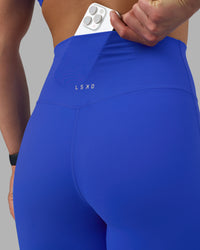 Woman wearing Elixir Ultra High-Rise Full Length Legging - Power Cobalt | Model:Keisha | Size:S | Thumbnail Index: 2