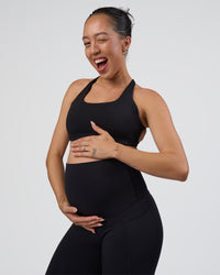 Woman wearing Elixir Ultra High-Rise Maternity Full Length Legging Pockets - Black | Model:Kitahna | Size:S | Thumbnail Index: 6