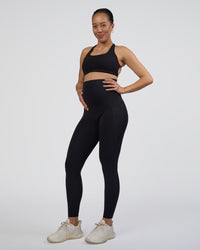 Woman wearing Elixir Ultra High-Rise Maternity Full Length Legging Pockets - Black | Model:Kitahna | Size:S | Thumbnail Index: 0