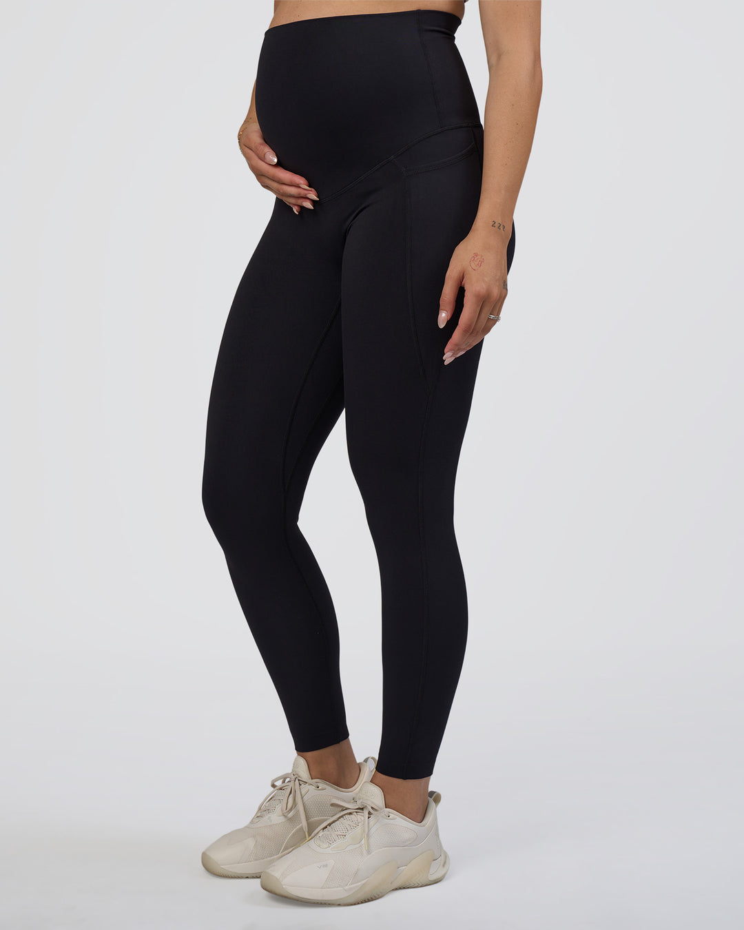 Woman wearing Elixir Ultra High-Rise Maternity Full Length Legging Pockets - Black | Model:Kitahna | Size:S - view 2