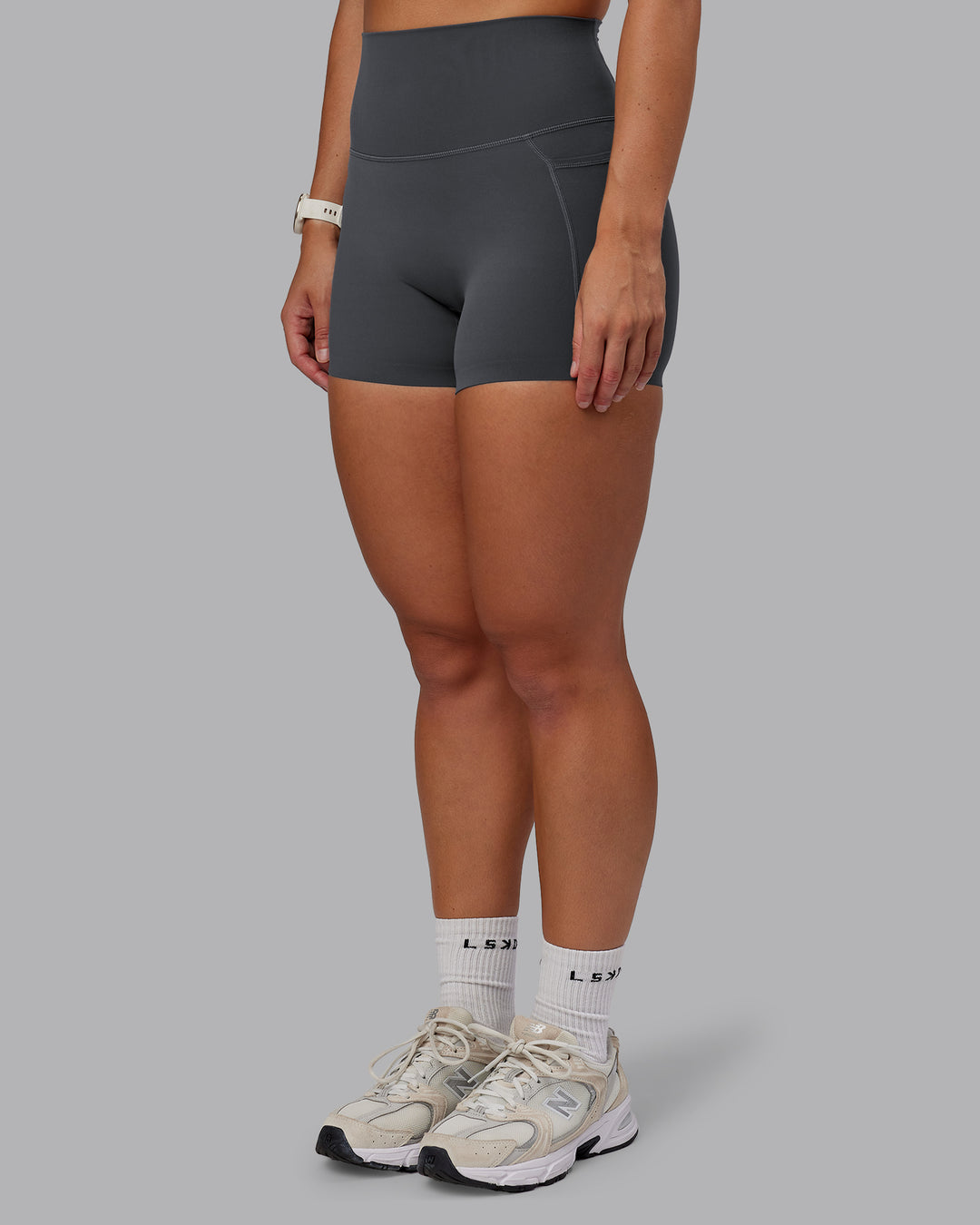 Woman wearing Elixir Ultra High-Rise 4" Short Pockets - Dark Storm | Model:Lyss | Size:S - view 8