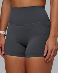 Woman wearing Elixir Ultra High-Rise 4" Short Pockets - Dark Storm | Model:Lyss | Size:S | Thumbnail Index: 6