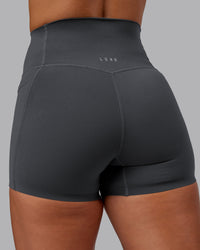 Woman wearing Elixir Ultra High-Rise 4" Short Pockets - Dark Storm | Model:Lyss | Size:S | Thumbnail Index: 8