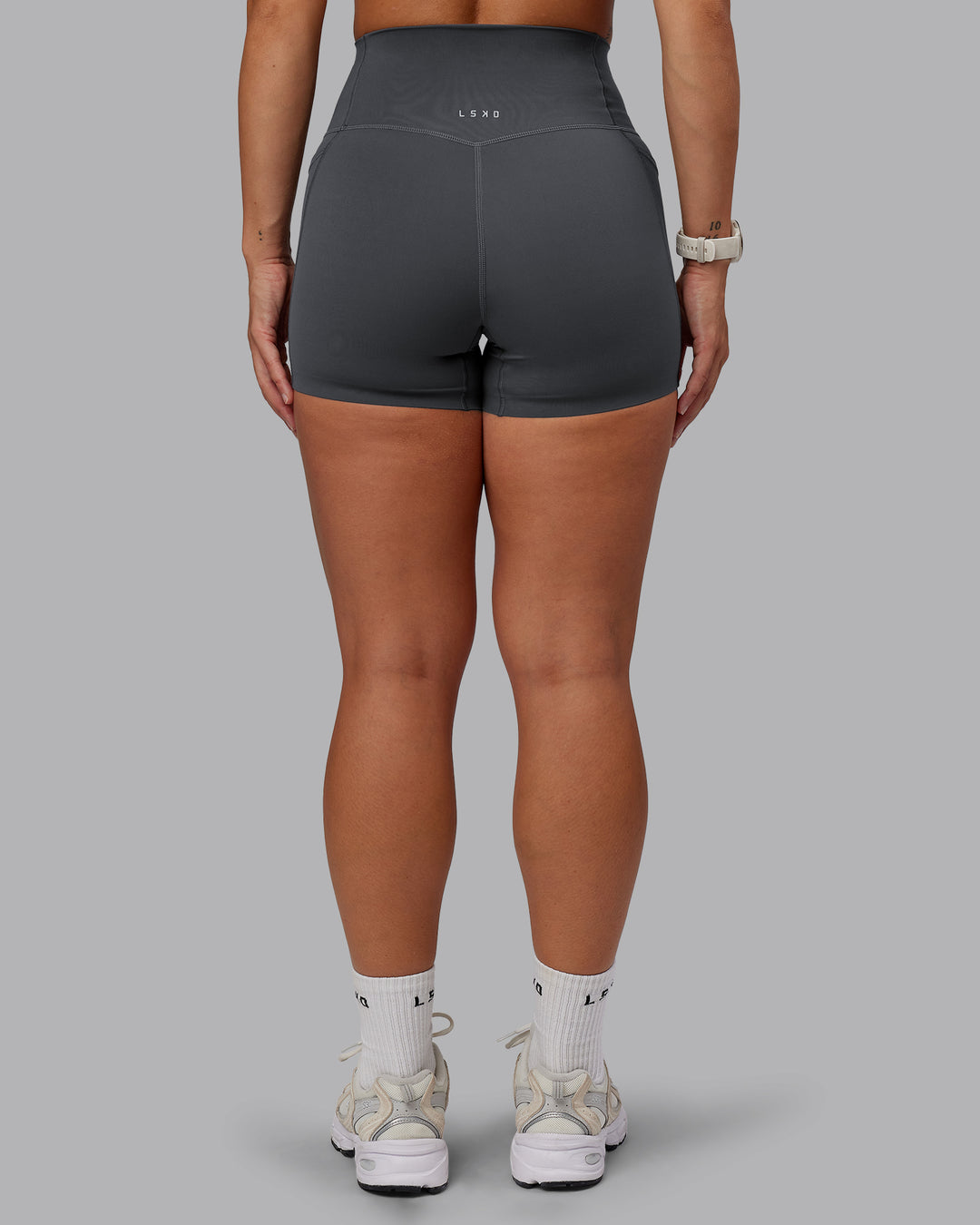 Woman wearing Elixir Ultra High-Rise 4" Short Pockets - Dark Storm | Model:Lyss | Size:S - view 4