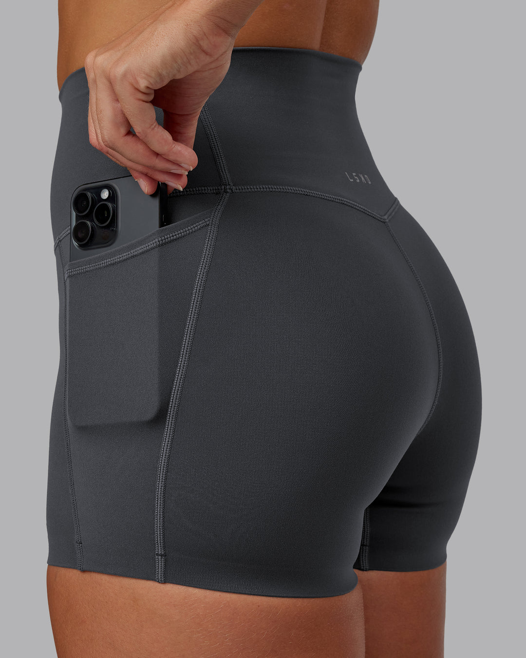 Woman wearing Elixir Ultra High-Rise 4" Short Pockets - Dark Storm | Model:Lyss | Size:S - view 5