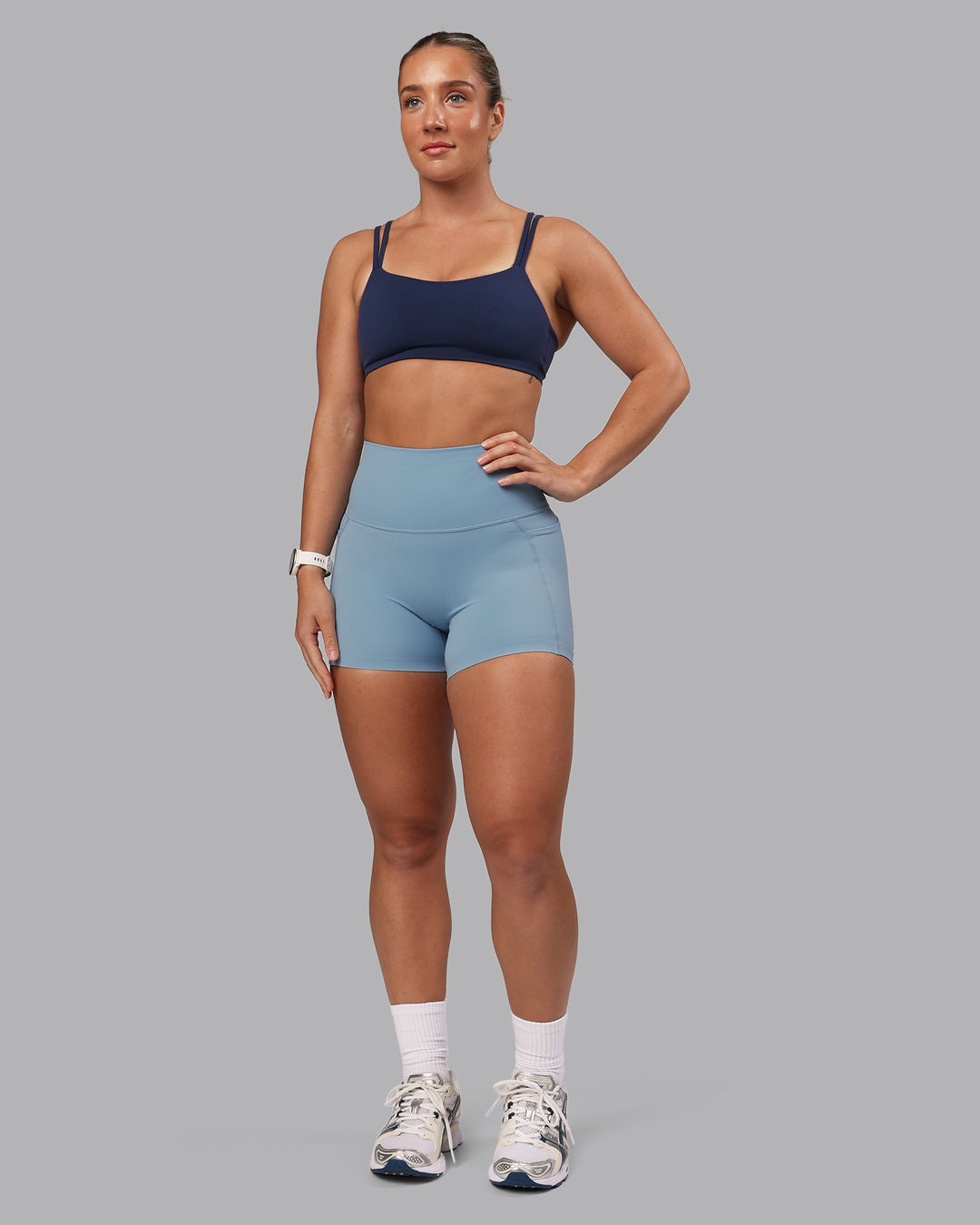 Woman wearing Elixir Ultra High-Rise 4" Short Pockets - Glacier Lake | Model:Lyss | Size:S - view 11