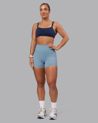 Woman wearing Elixir Ultra High-Rise 4" Short Pockets - Glacier Lake | Model:Lyss | Size:S | Thumbnail Index: 10