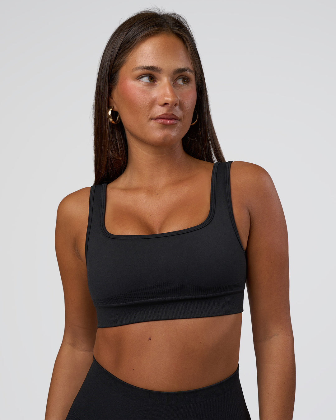 Woman wearing Ember Seamless Sports Bra - Black | Model:Brylee | Size:XS - view 6