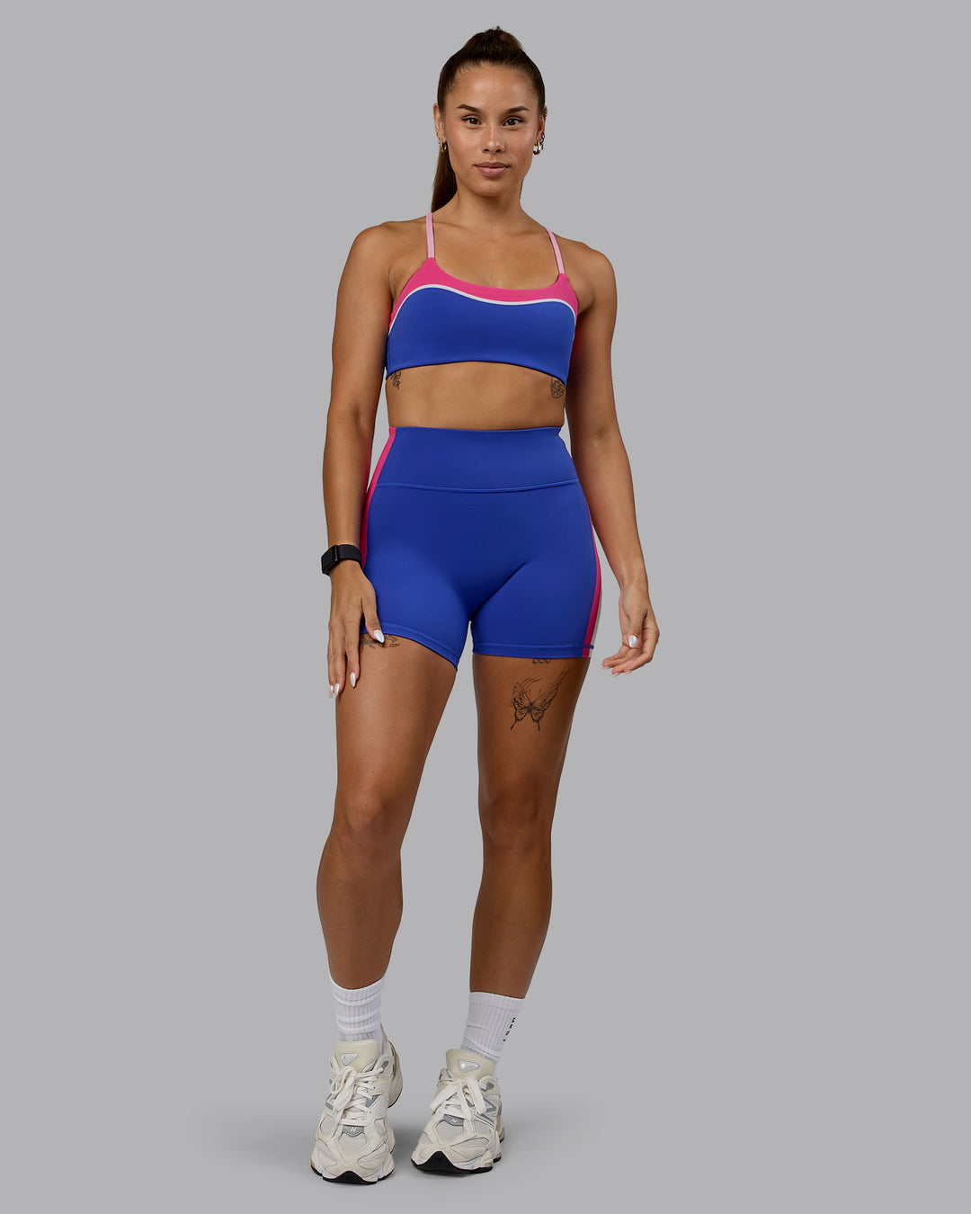 Woman wearing Embrace Sports Bra - Power Cobalt-Fuchsia Pink - view 6