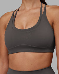 Woman wearing Empower Sports Bra - Dark Storm | Model:Rhiley | Size:S | Thumbnail Index: 3