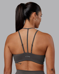 Woman wearing Empower Sports Bra - Dark Storm | Model:Rhiley | Size:S | Thumbnail Index: 1