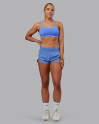 Woman wearing Energy 1.8" Training Shorts - Ultramarine | Thumbnail Index: 1