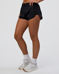Woman wearing Energy 1.8" Training Short - Black | Model:Amity | Size:S | Thumbnail Index: 0