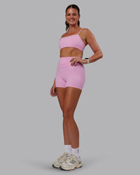 Woman wearing Enhance Ultra High-Rise 4" Short - Pink Frosting | Model:Phoebe | Size:S | Thumbnail Index: 9