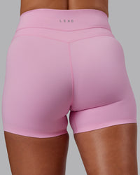 Woman wearing Enhance Ultra High-Rise 4" Short - Pink Frosting | Model:Phoebe | Size:S | Thumbnail Index: 11