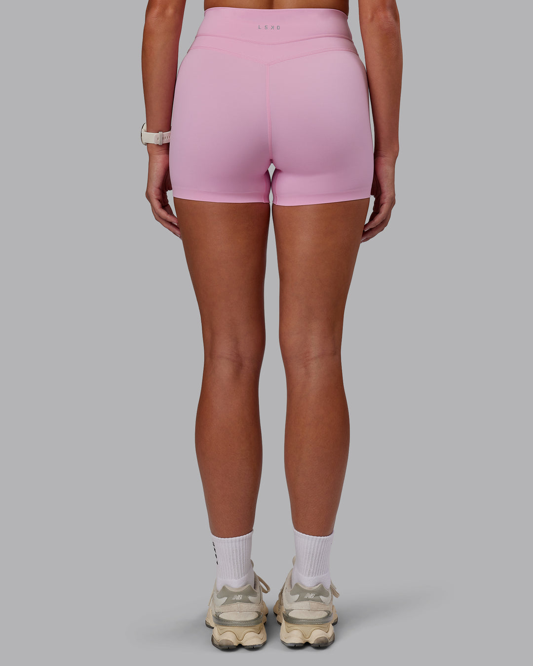 Woman wearing Enhance Ultra High-Rise 4" Short - Pink Frosting | Model:Phoebe | Size:S - view 5