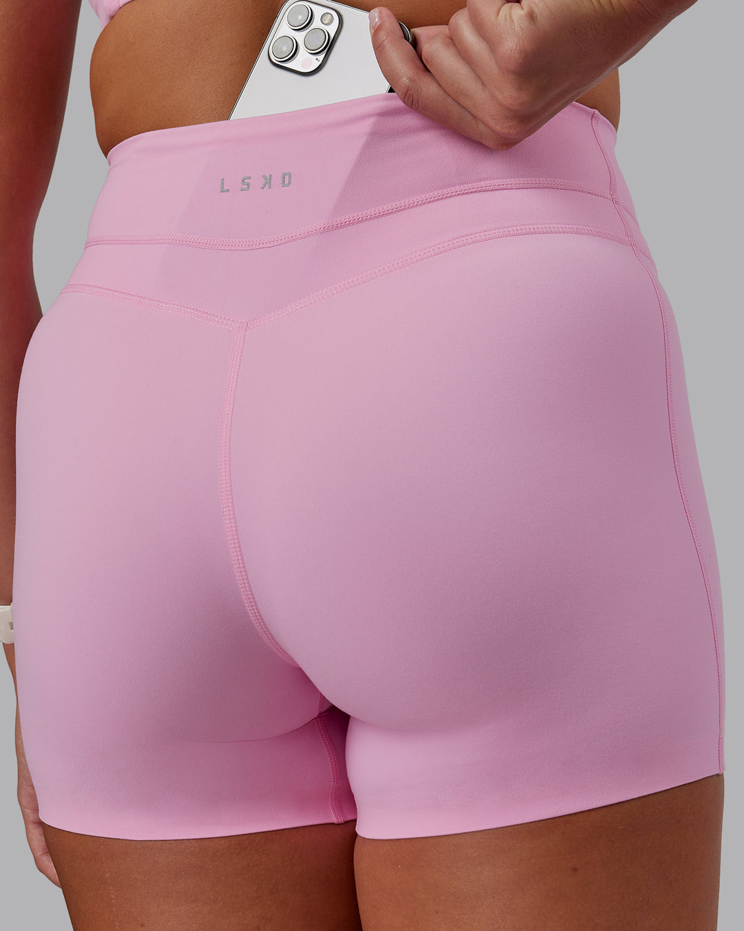 Woman wearing Enhance Ultra High-Rise 4" Short - Pink Frosting | Model:Phoebe | Size:S - view 6
