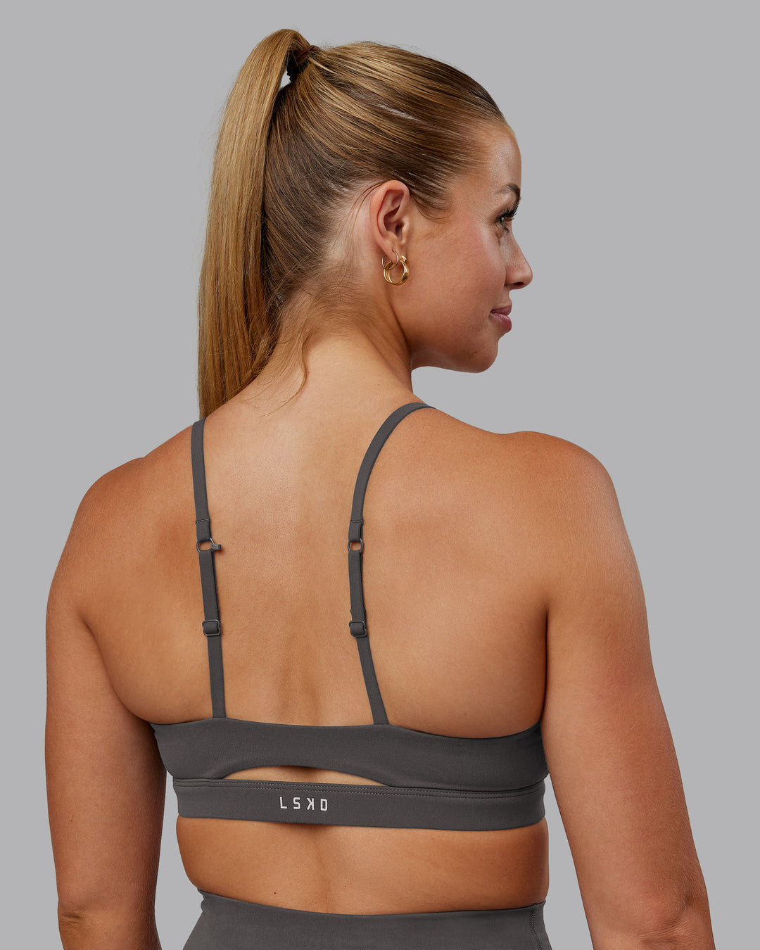Woman wearing Essence Sports Bra - Dark Storm | Model:Hannah | Size:S - view 5