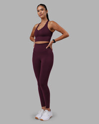 Woman wearing Evoke Longline Sports Bra - Cherry Lacquer | Model:Rhiley | Size:S | Thumbnail Index: 4