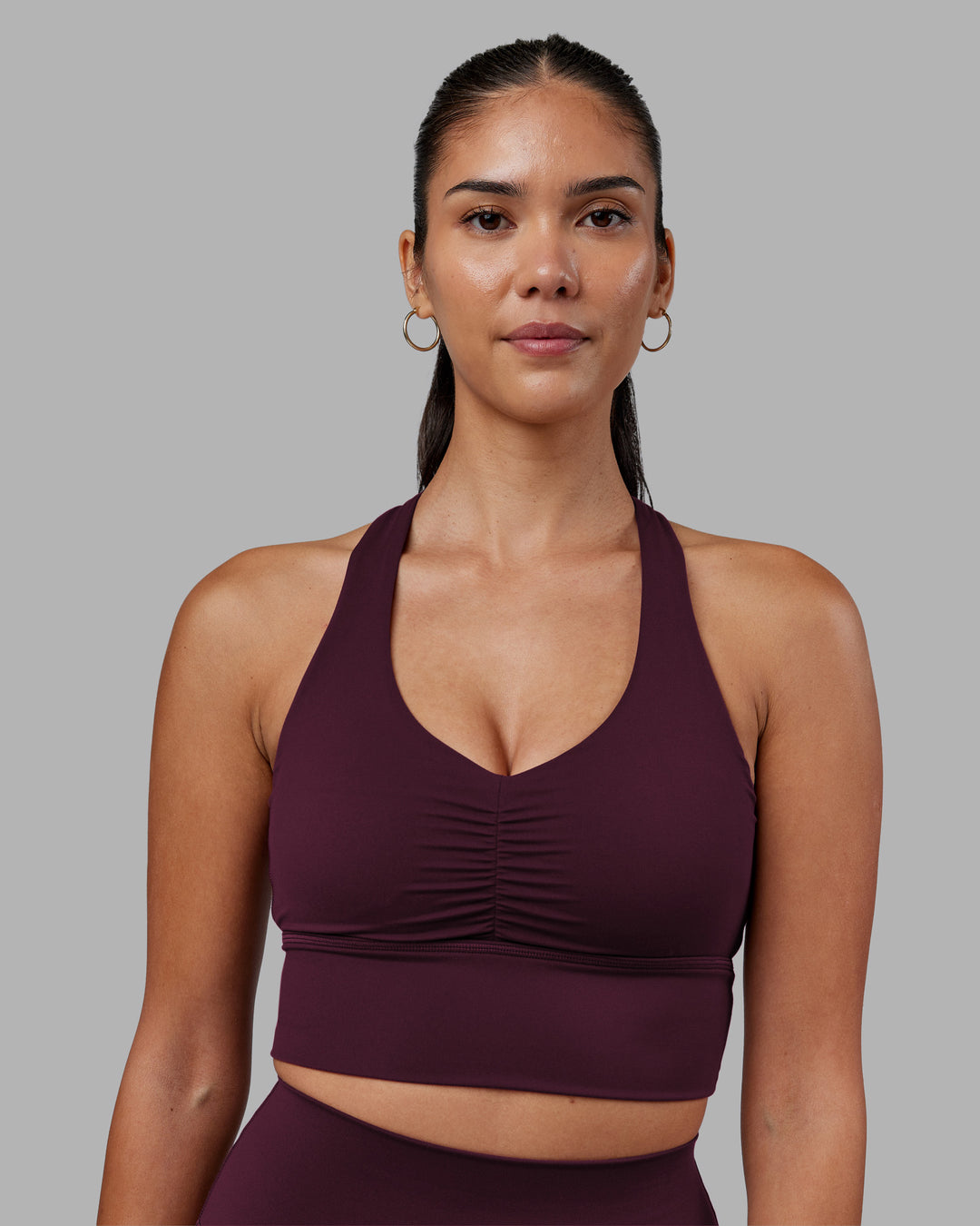 Woman wearing Evoke Longline Sports Bra - Cherry Lacquer | Model:Rhiley | Size:S - view 3