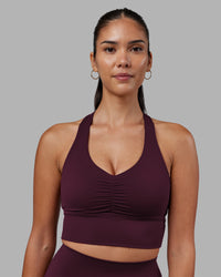 Woman wearing Evoke Longline Sports Bra - Cherry Lacquer | Model:Rhiley | Size:S | Thumbnail Index: 2