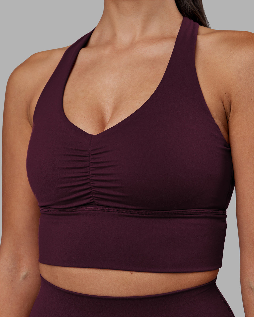 Woman wearing Evoke Longline Sports Bra - Cherry Lacquer | Model:Rhiley | Size:S - view 6