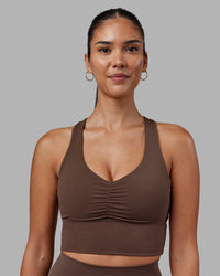 Woman wearing Evoke Longline Sports Bra - Chocolate Martini | Model:Rhiley | Size:S | Thumbnail Index: 0