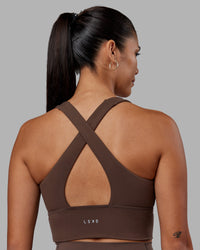 Woman wearing Evoke Longline Sports Bra - Chocolate Martini | Model:Rhiley | Size:S | Thumbnail Index: 1