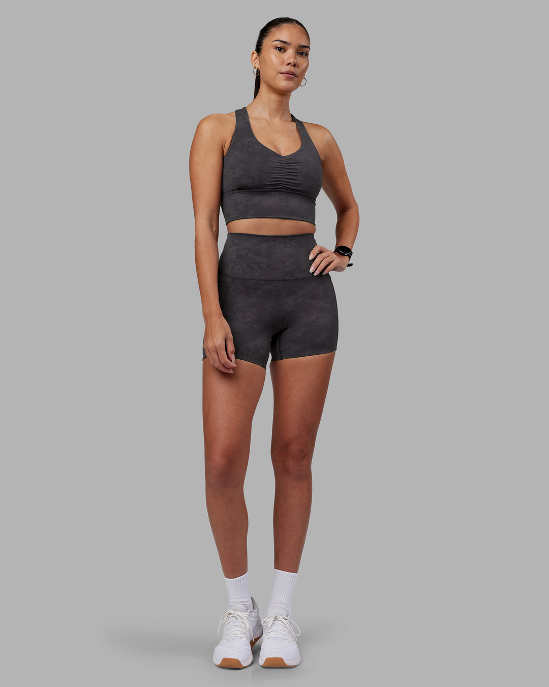 Woman wearing Evoke Longline Sports Bra - Dark Storm Wash | Model:Rhiley | Size:S - view 5