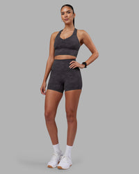 Woman wearing Evoke Longline Sports Bra - Dark Storm Wash | Model:Rhiley | Size:S | Thumbnail Index: 2