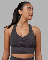 Woman wearing Evoke Longline Sports Bra - Dark Storm Wash | Model:Rhiley | Size:S | Thumbnail Index: 0