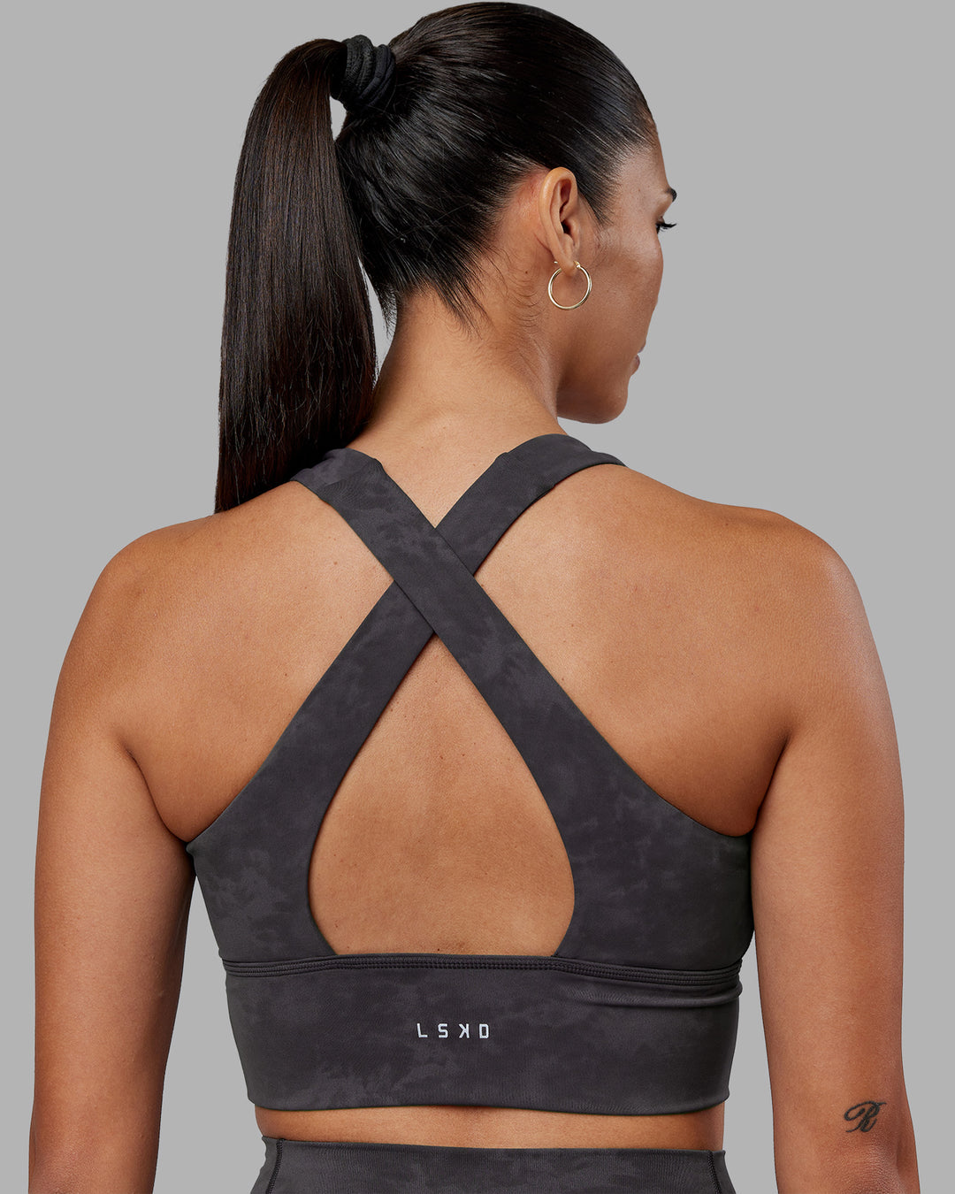 Woman wearing Evoke Longline Sports Bra - Dark Storm Wash | Model:Rhiley | Size:S - view 2